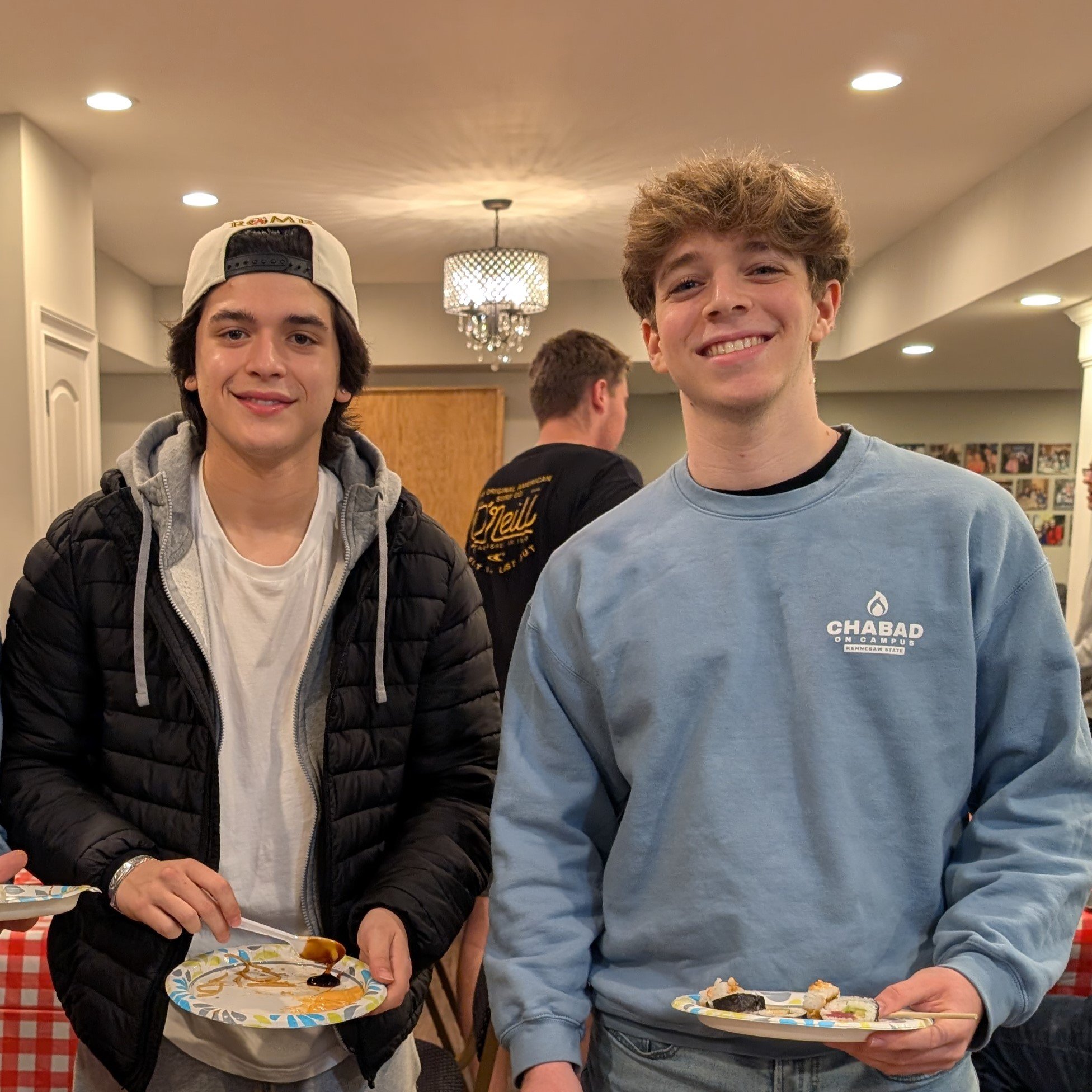 Group celebrating at Shabbat dinner